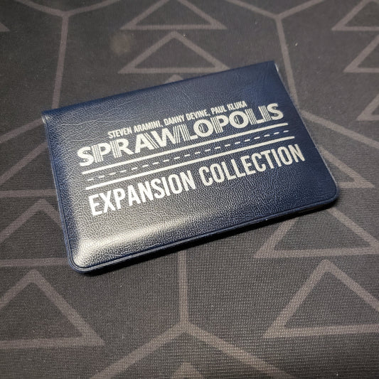 Image shows the front of the card wallet of the Expansion Collection for the card game Sprawlopolis