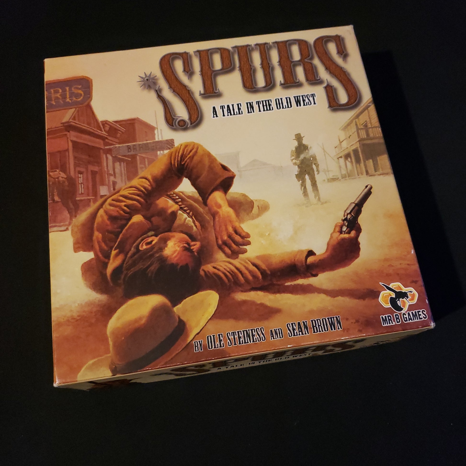 Image shows the front cover of the box of the Spurs board game