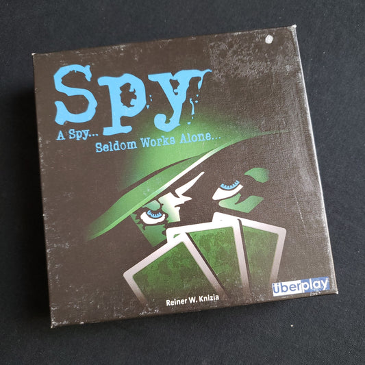 Image shows the front cover of the box of the Spy card game