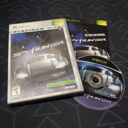 Image shows the case, manual and disc for the video game Spy Hunter for the original Xbox