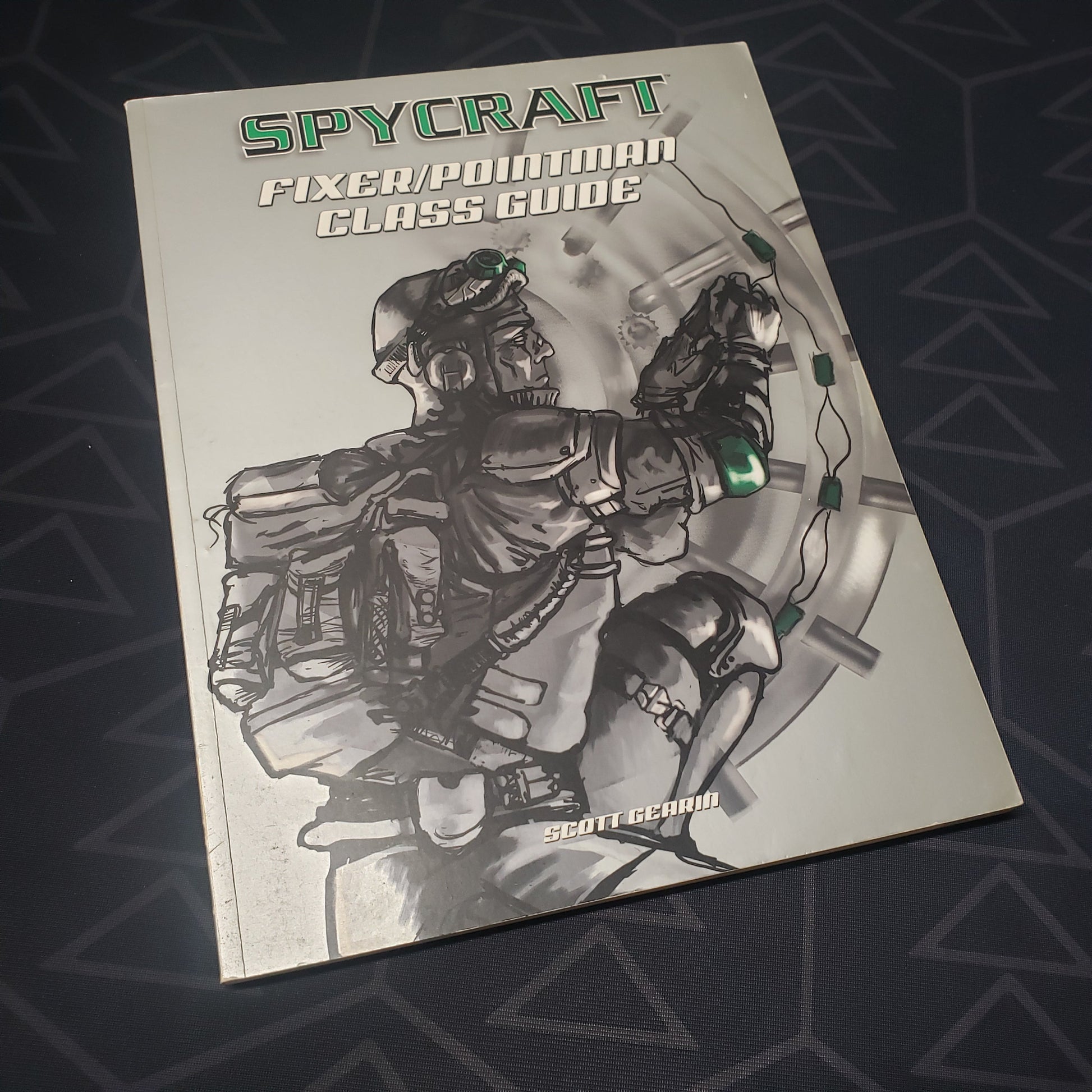Image shows the front cover of the Fixer / Pointman Class Guide book for the roleplaying game Spycraft