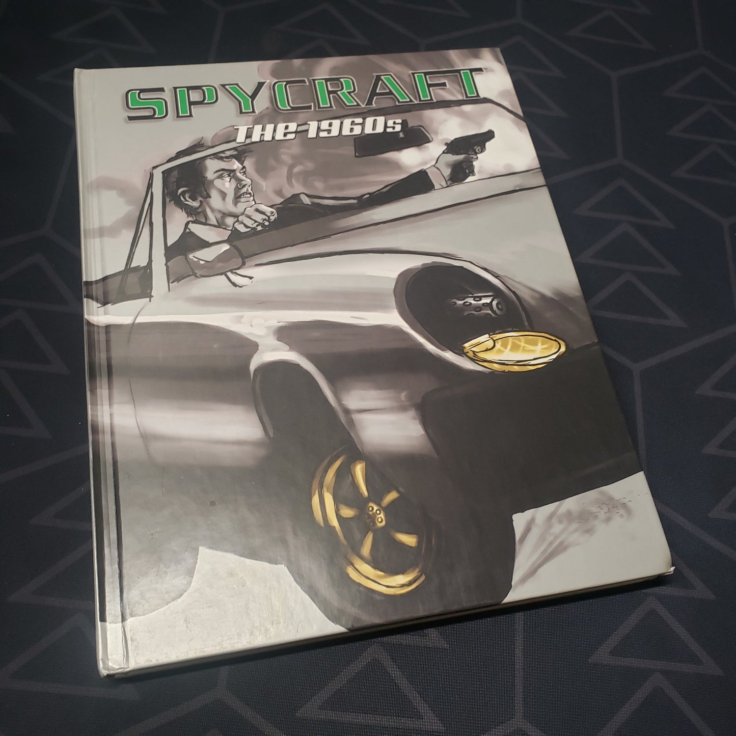 Image shows the front cover of the 1960s Decade Book for the roleplaying game Spycraft