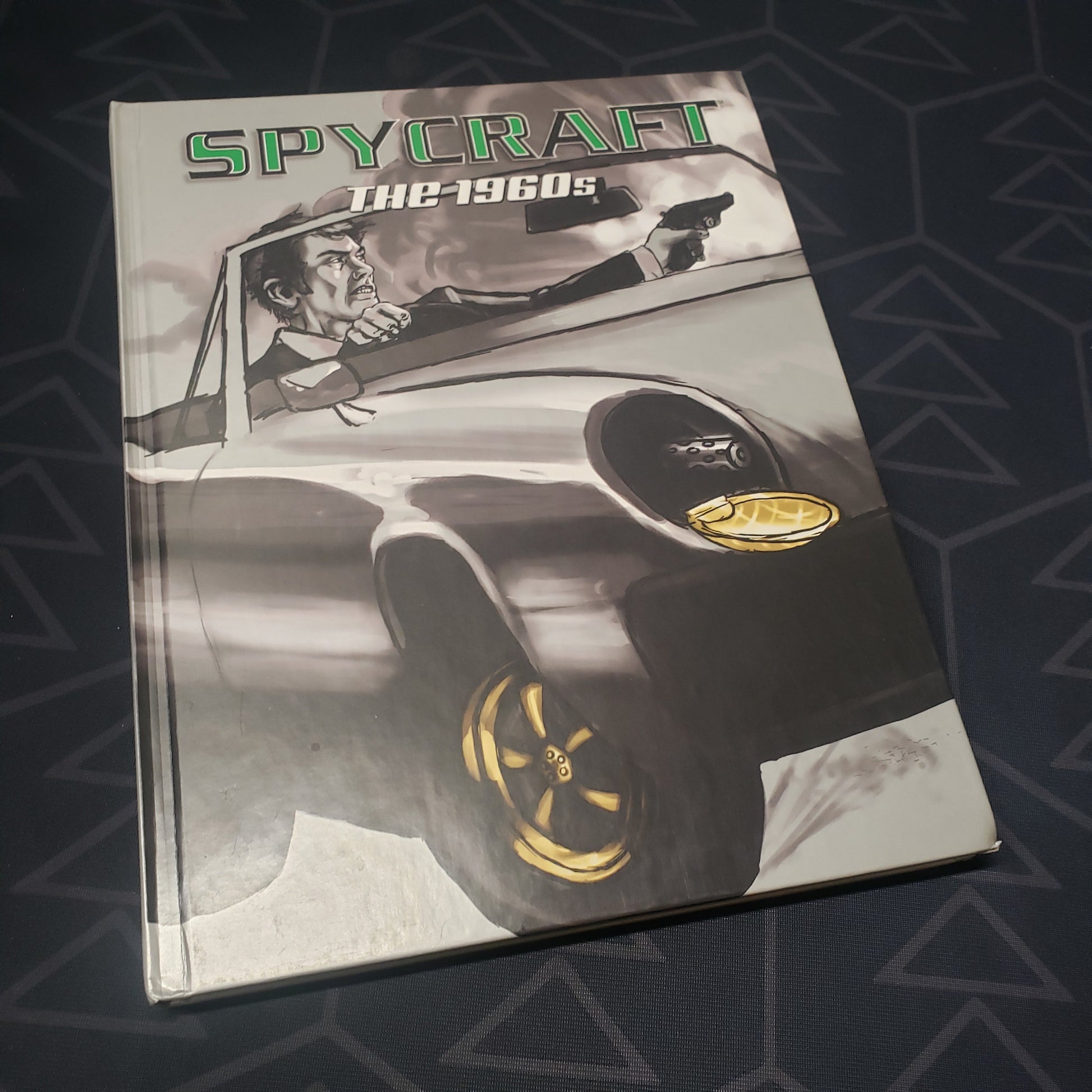 Image shows the front cover of the 1960s Decade Book for the roleplaying game Spycraft