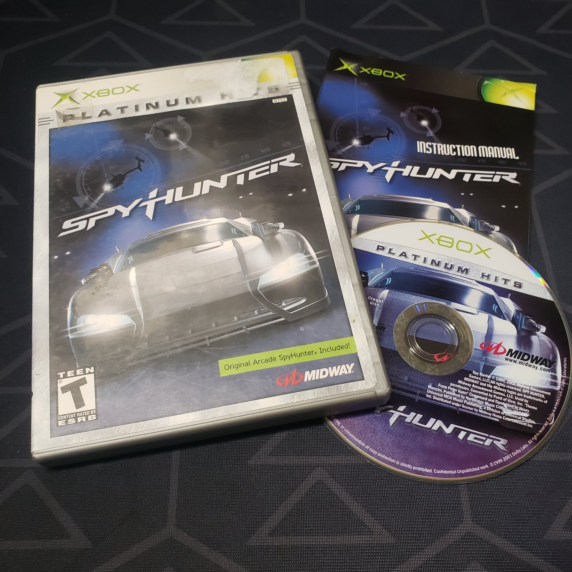 Image shows the case, manual and disc for the video game SpyHunter for the original Xbox