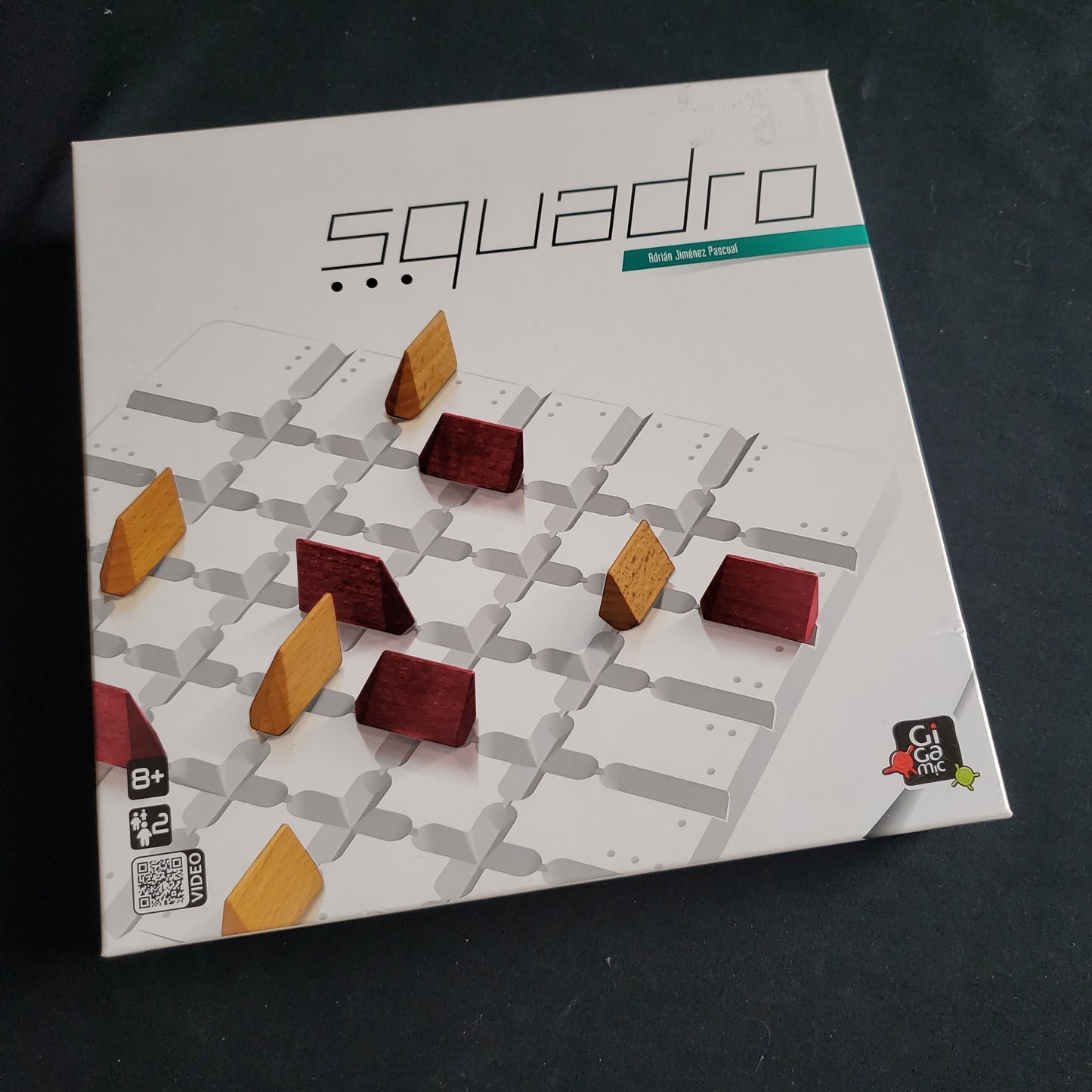Image shows the front cover of the box of the Squadro board game