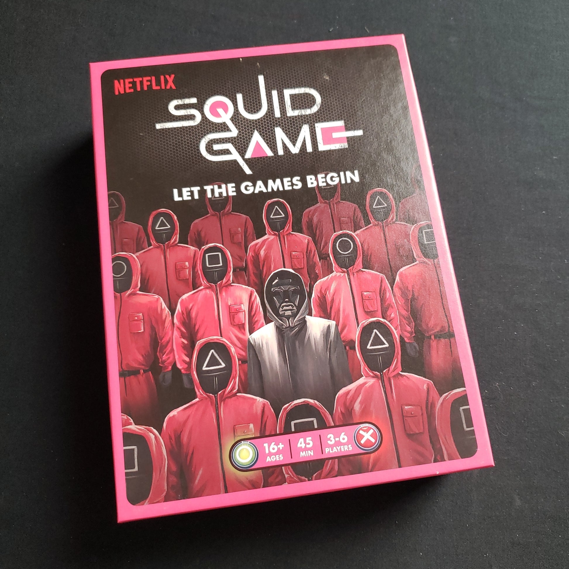 Image shows the front cover of the box of the Squid Game board game