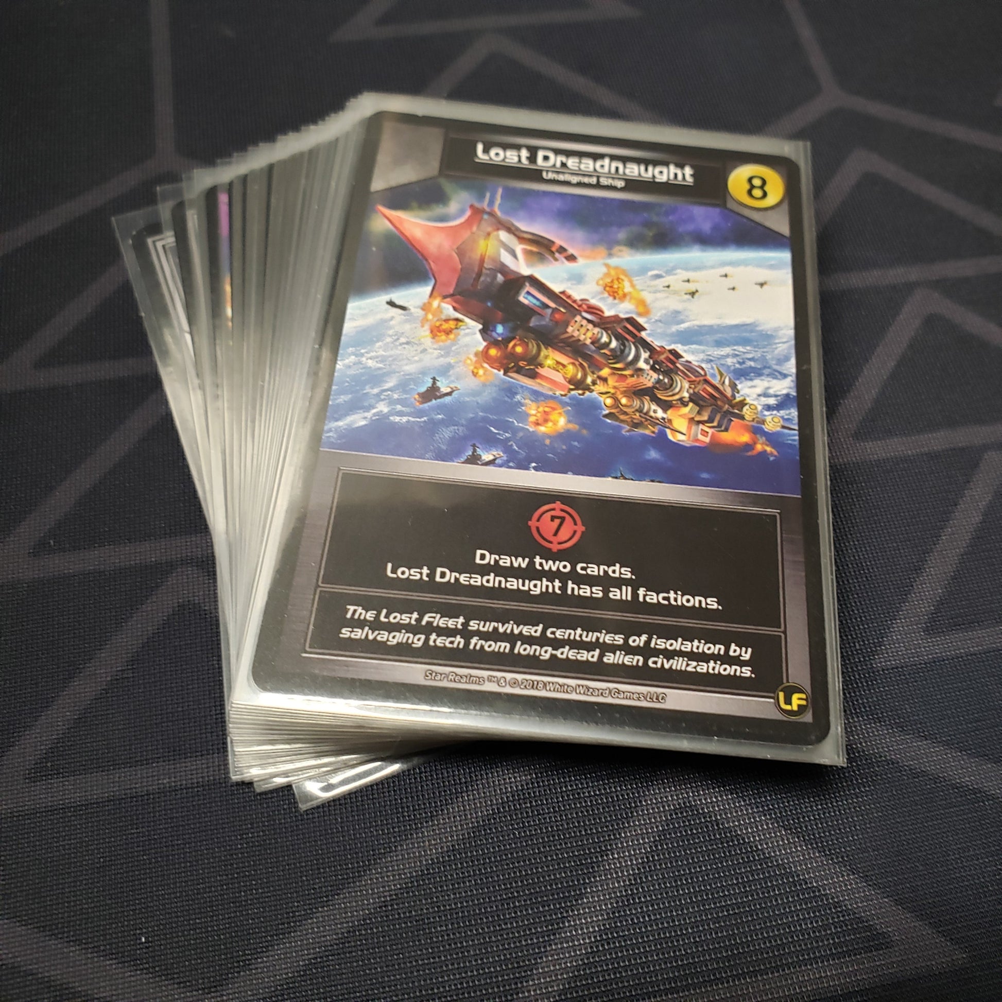 Image shows the fanned out cards of the Command Deck: Lost Fleet expansion for the card game Star Realms