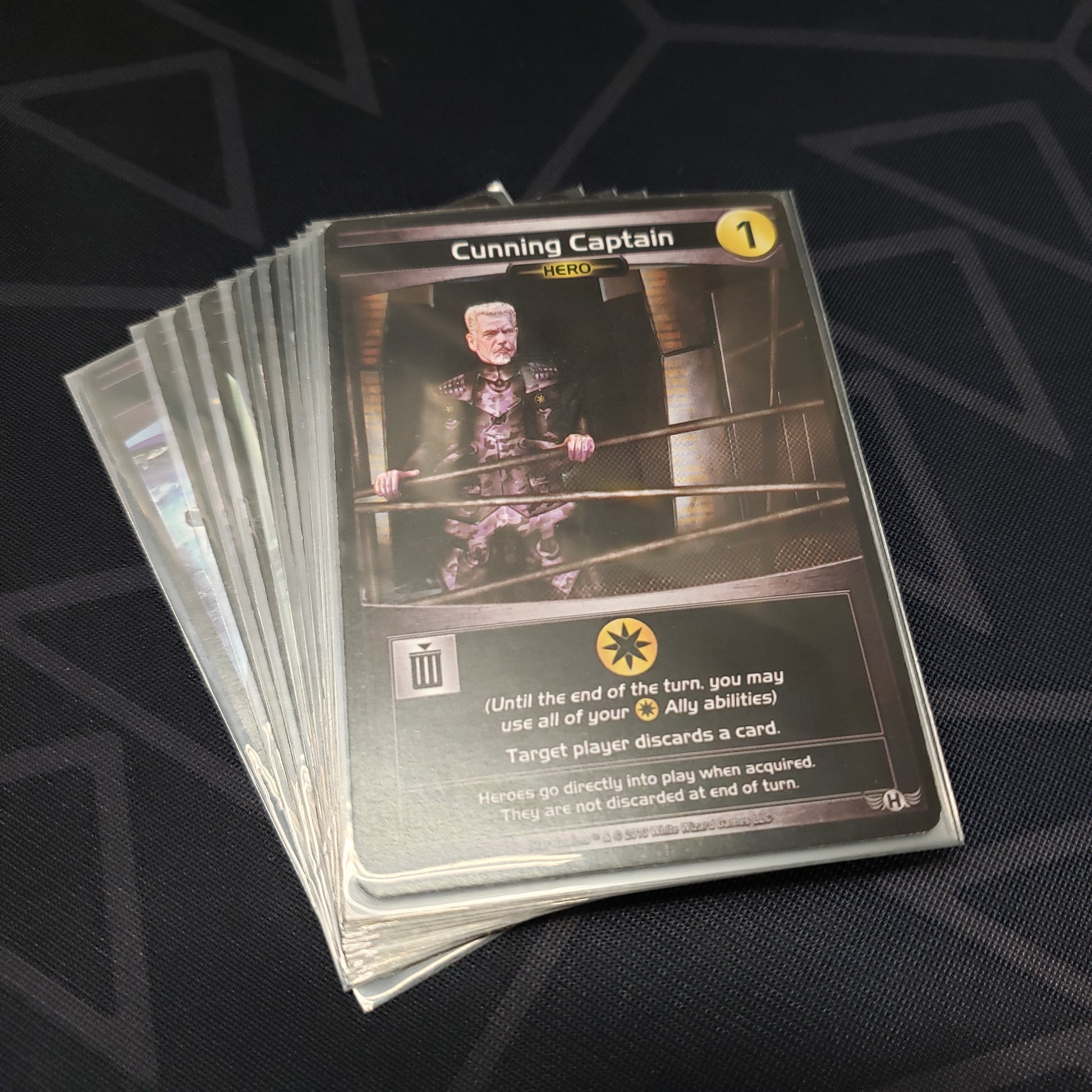 Image shows the cards for the Crisis: Heroes expansion for the card game Star Realms fanned out in a stack