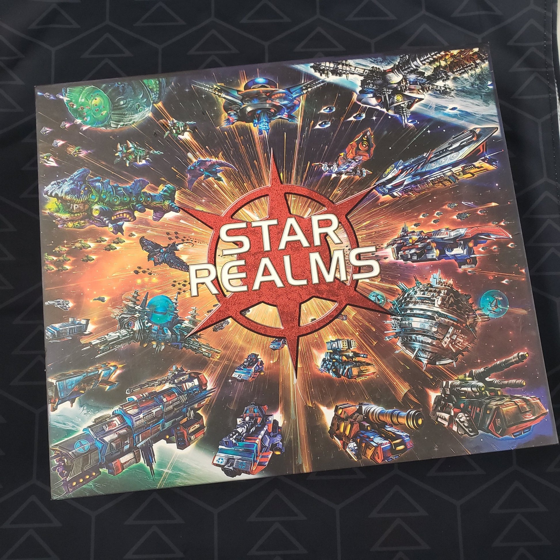 Image shows the front cover of the box of the Star Realms: Deluxe Nova Collection