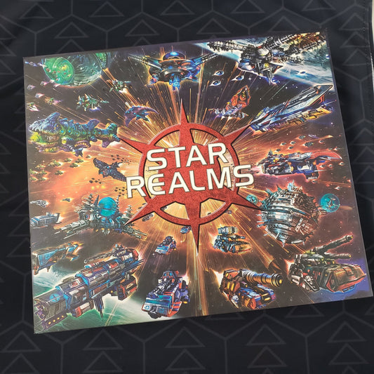 Image shows the front cover of the box of the Star Realms: Deluxe Nova Collection