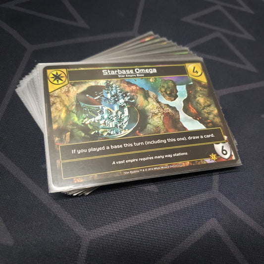 Image shows the cards for the Promo Pack 1 expansion for the card game Star Realms fanned out in a stack