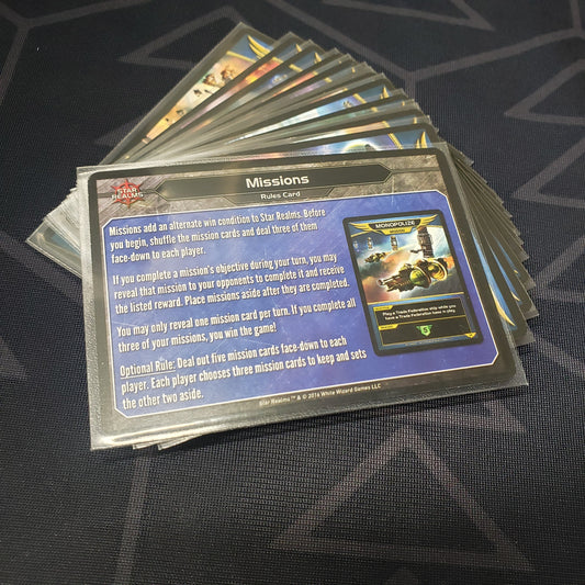 Image shows the cards for the United: Missions expansion for the card game Star Realms fanned out in a stack
