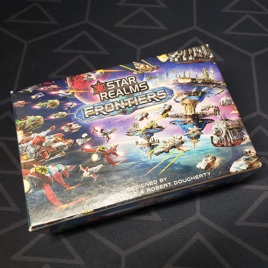 Image shows the front cover of the box of the card game Star Realms: Frontiers