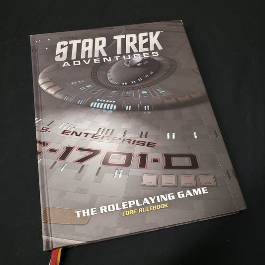 Image shows the front cover of the collector's edition core rulebook for the roleplaying game Star Trek Adventures