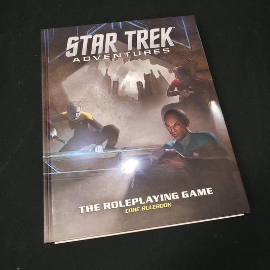 Image shows the front cover of the core rulebook for the roleplaying game Star Trek Adventures