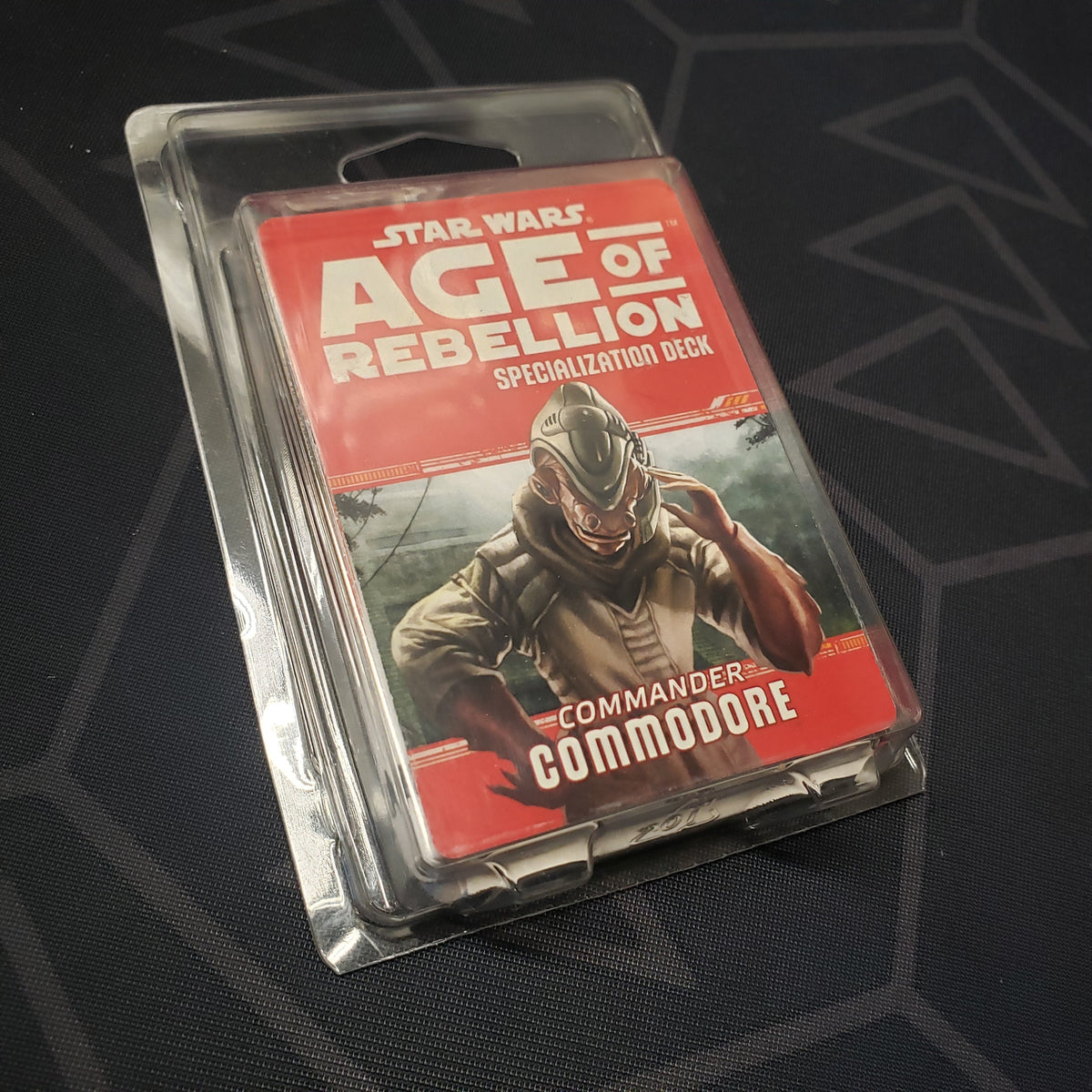 Image shows the front of the clamshell packaging for the Commander Commodore Deck for the roleplaying game Star Wars: Age of Rebellion