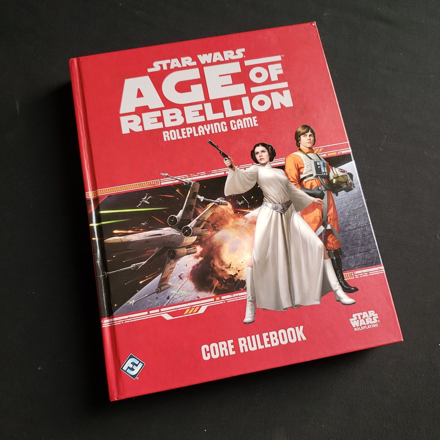 Image shows the front cover of the Core Rulebook for the Star Wars: Age of Rebellion roleplaying game