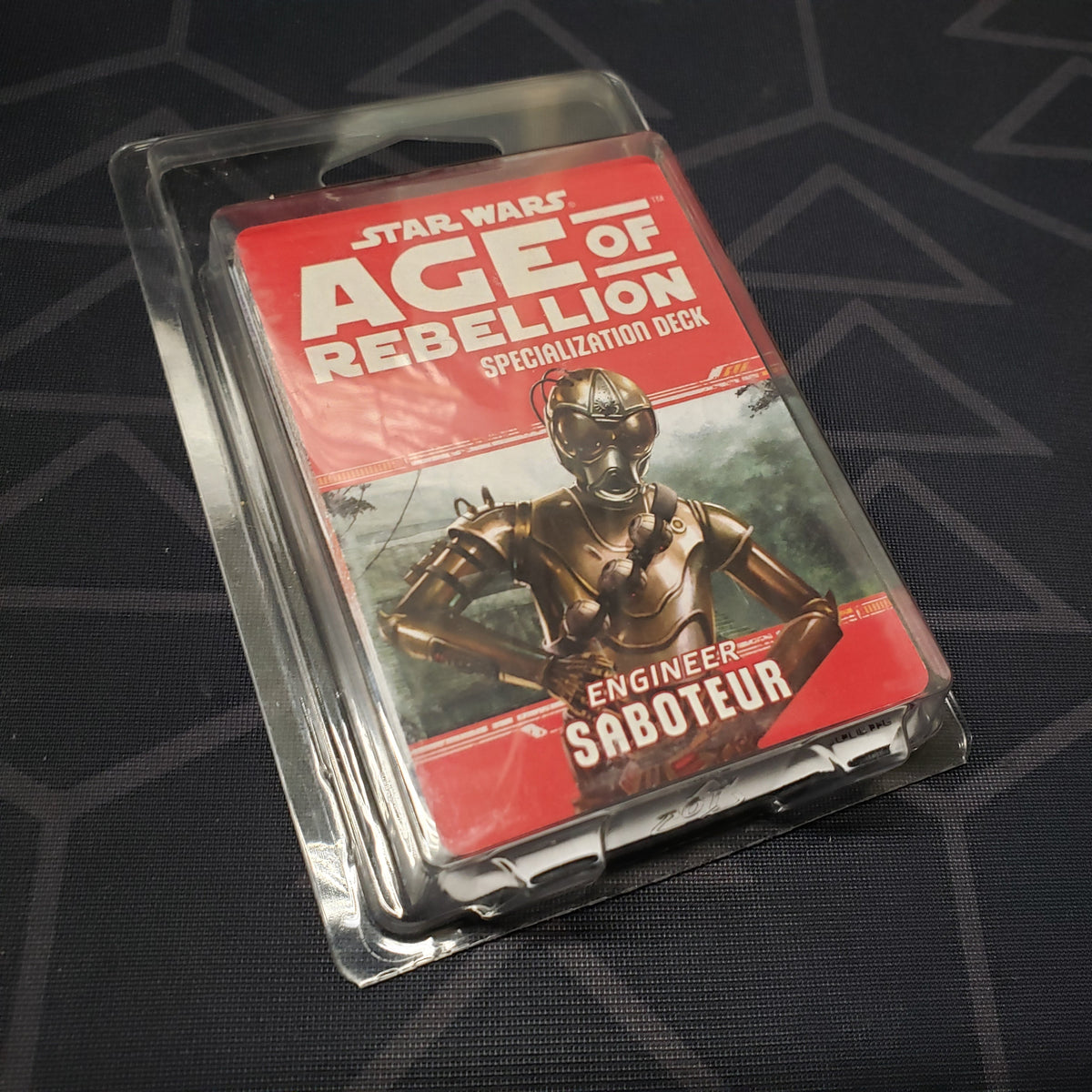 Image shows the front of the clamshell packaging for the Engineer Saboteur Deck for the roleplaying game Star Wars: Age of Rebellion