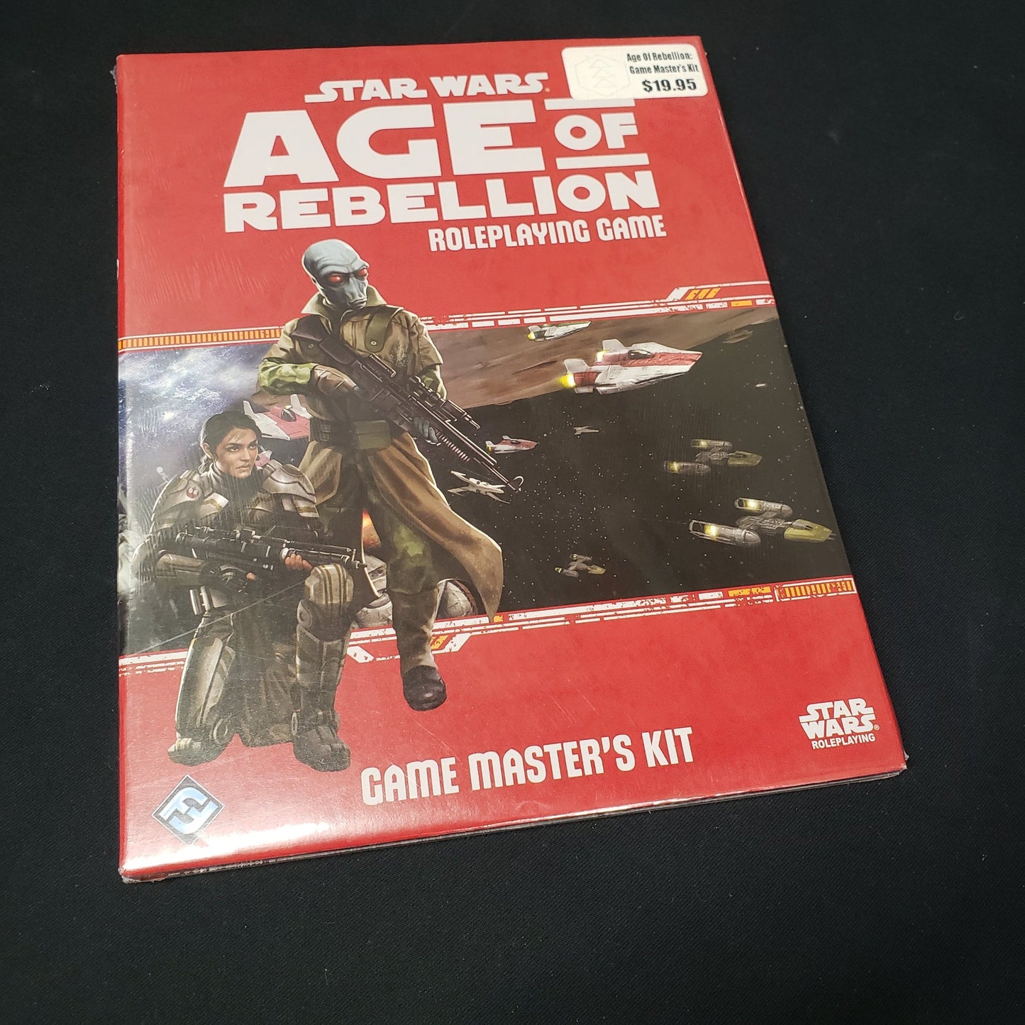 Image shows the front of the packaging for the Game Master's Kit  for the Star Wars: Age of Rebellion roleplaying game