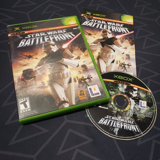 Image shows the case, manual and disc for the video game Star Wars Battlefront for the original Xbox