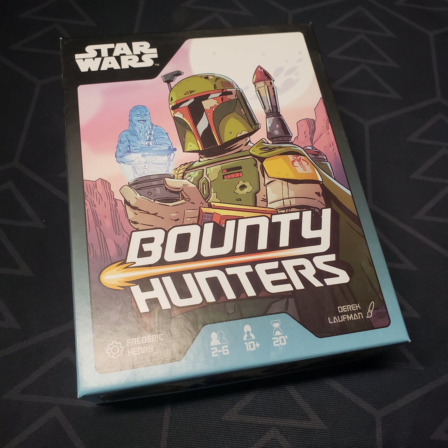 Image shows the front cover of the box for the Star Wars: Bounty Hunters card game