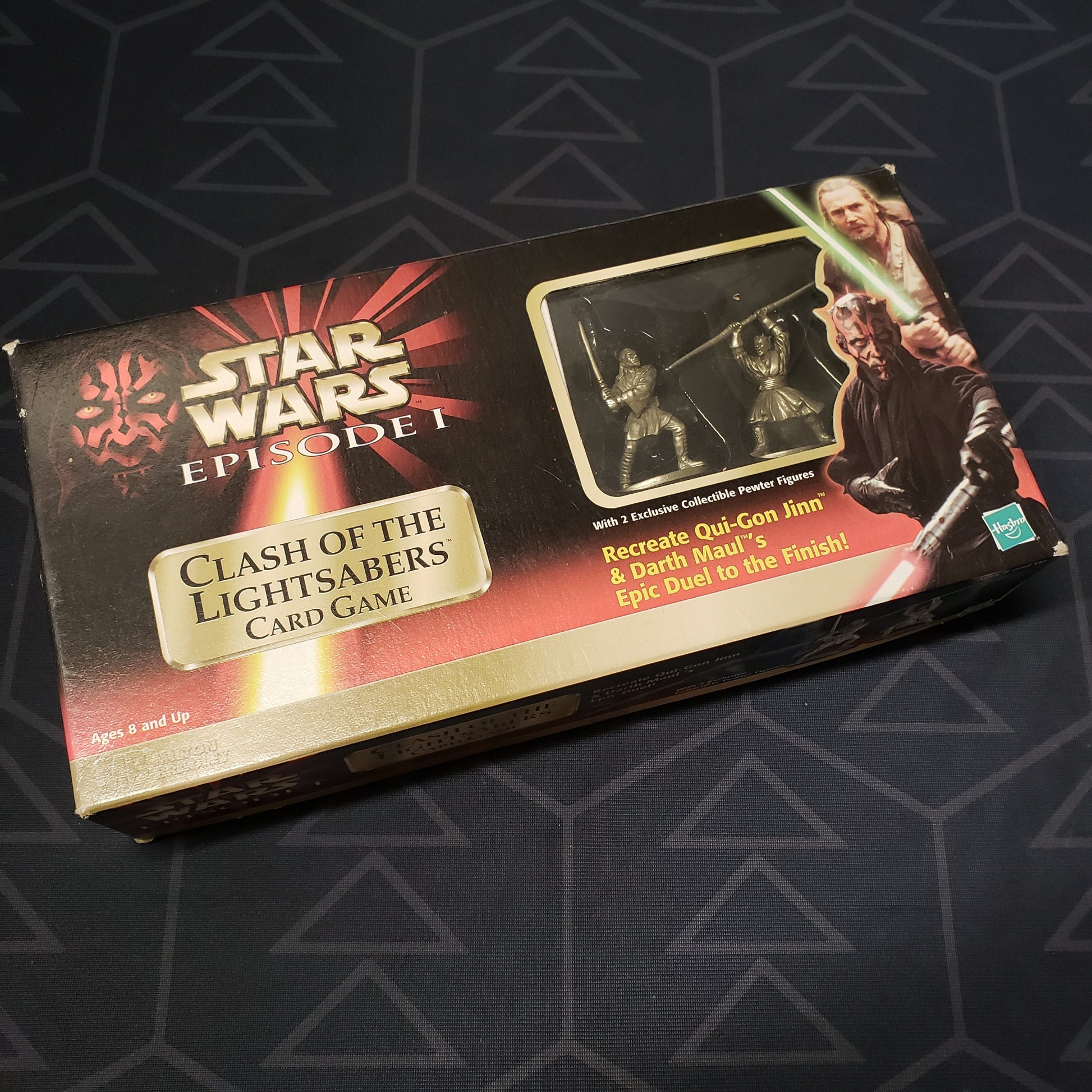 Image shows the front cover of the box for the Star Wars: Clash of the Lightsabers card game