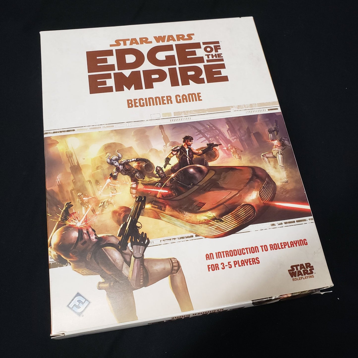 Image shows the front cover of the box of the Beginner Game set for the Star Wars: Edge of the Empire roleplaying game