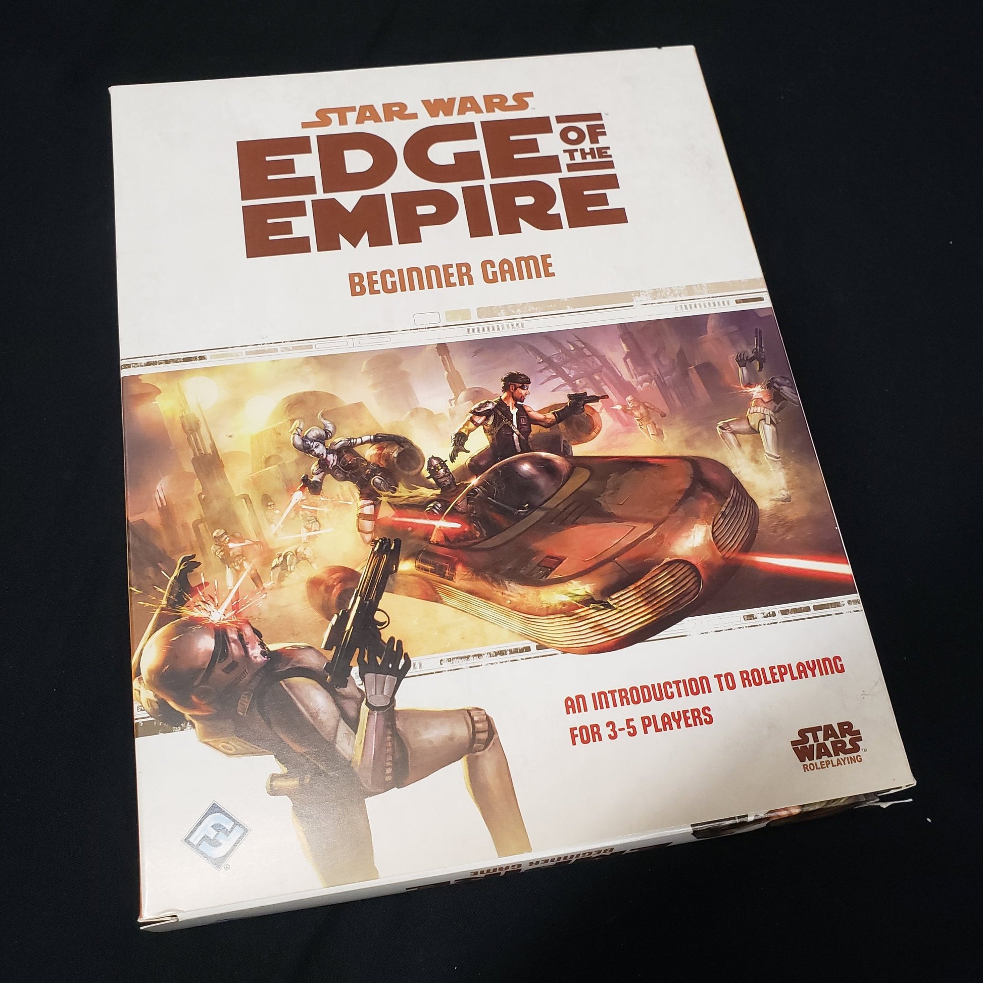 Image shows the front cover of the box of the Beginner Game set for the Star Wars: Edge of the Empire roleplaying game