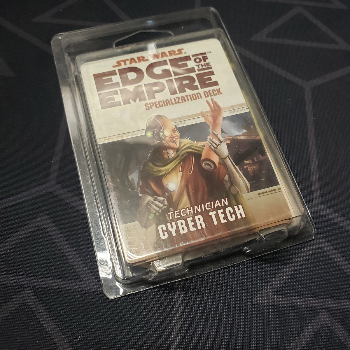 Image shows the front of the clamshell packaging for the Technician Cyber Tech Deck for the roleplaying game Star Wars: Edge of the Empire