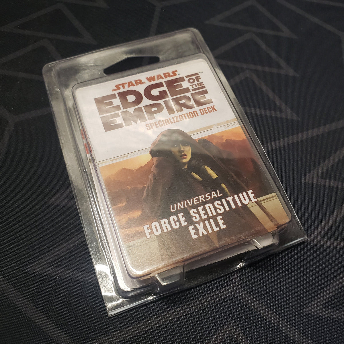 Image shows the front of the clamshell packaging for the Universal Force Sensitive Exile Deck for the roleplaying game Star Wars: Edge of the Empire