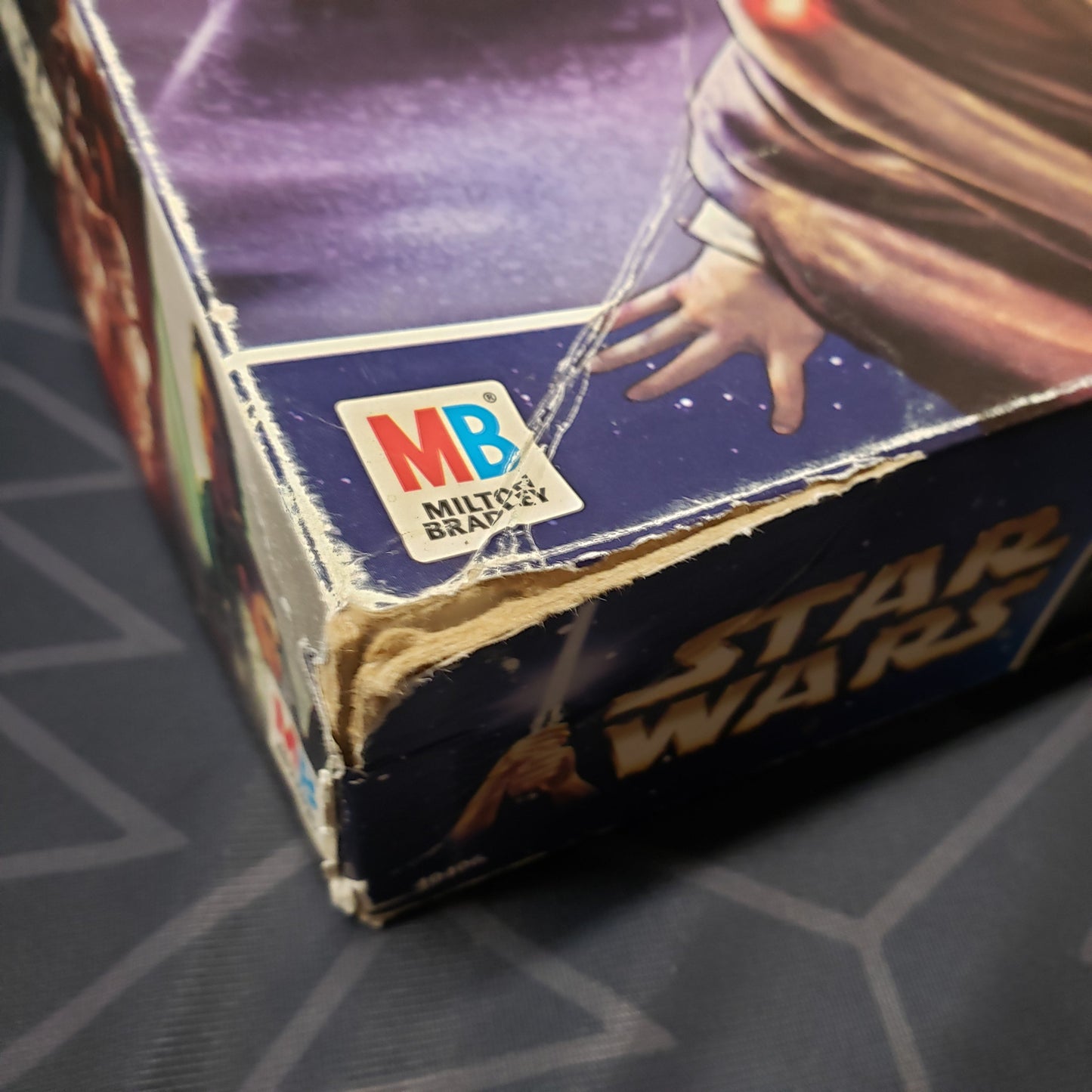 Image shows some corner damage on the box for the Star Wars: Epic Duels board game