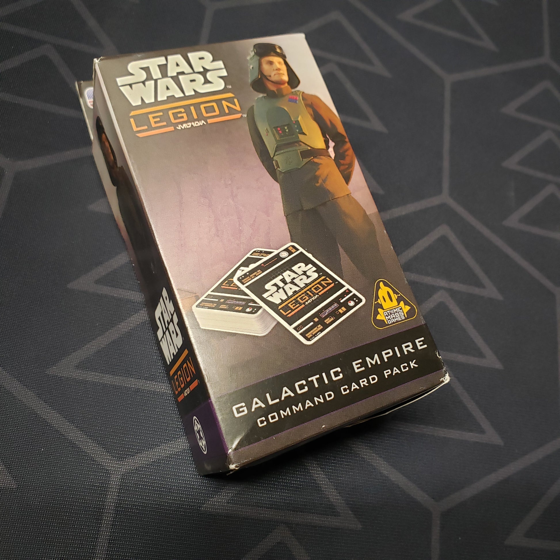 Image shows the front cover of the box of the Galactic Empire Command Card pack for the miniatures game Star Wars Legion