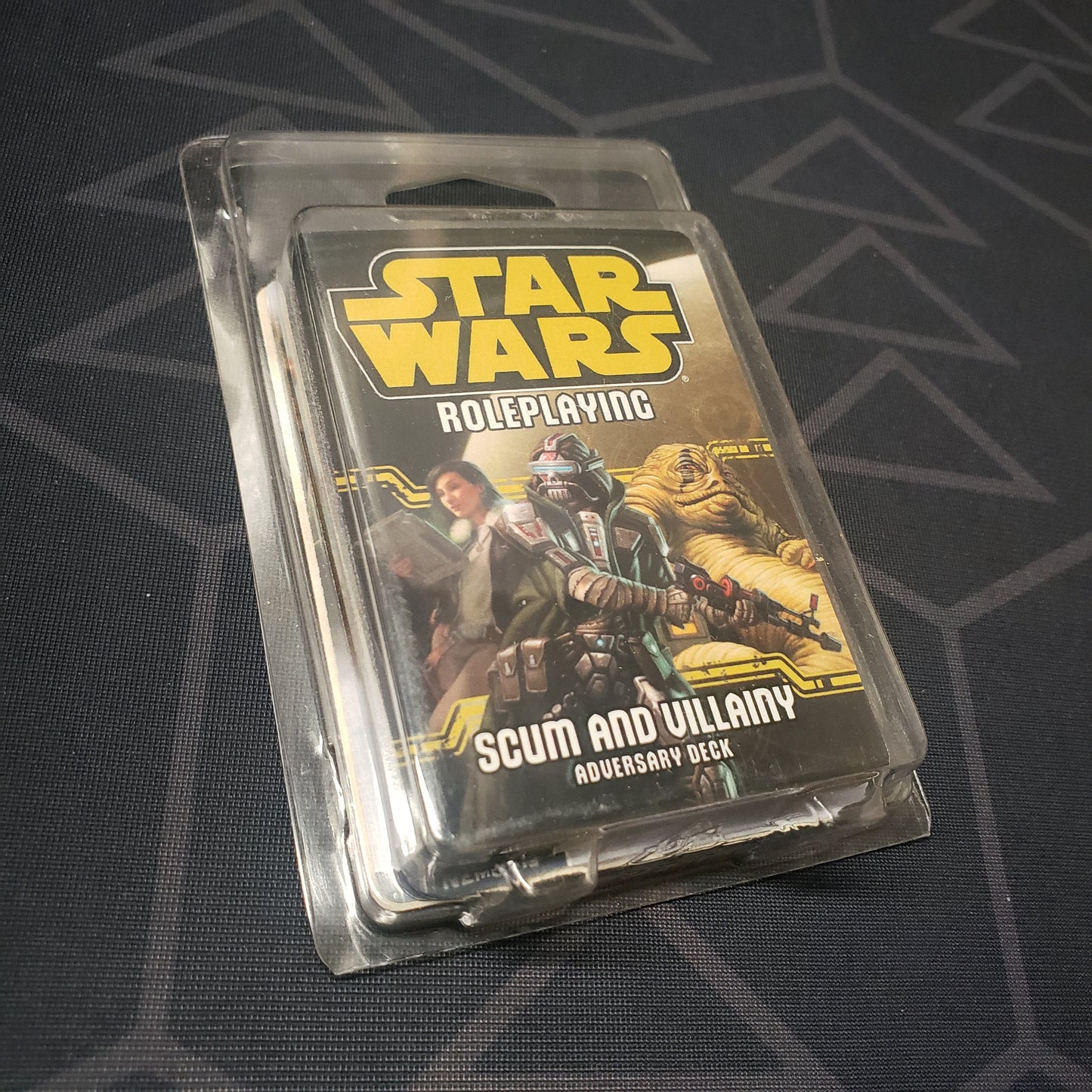 Image shows the front of the clamshell packaging for the Scum and Villainy Adversary Deck for the Star Wars Roleplaying game system