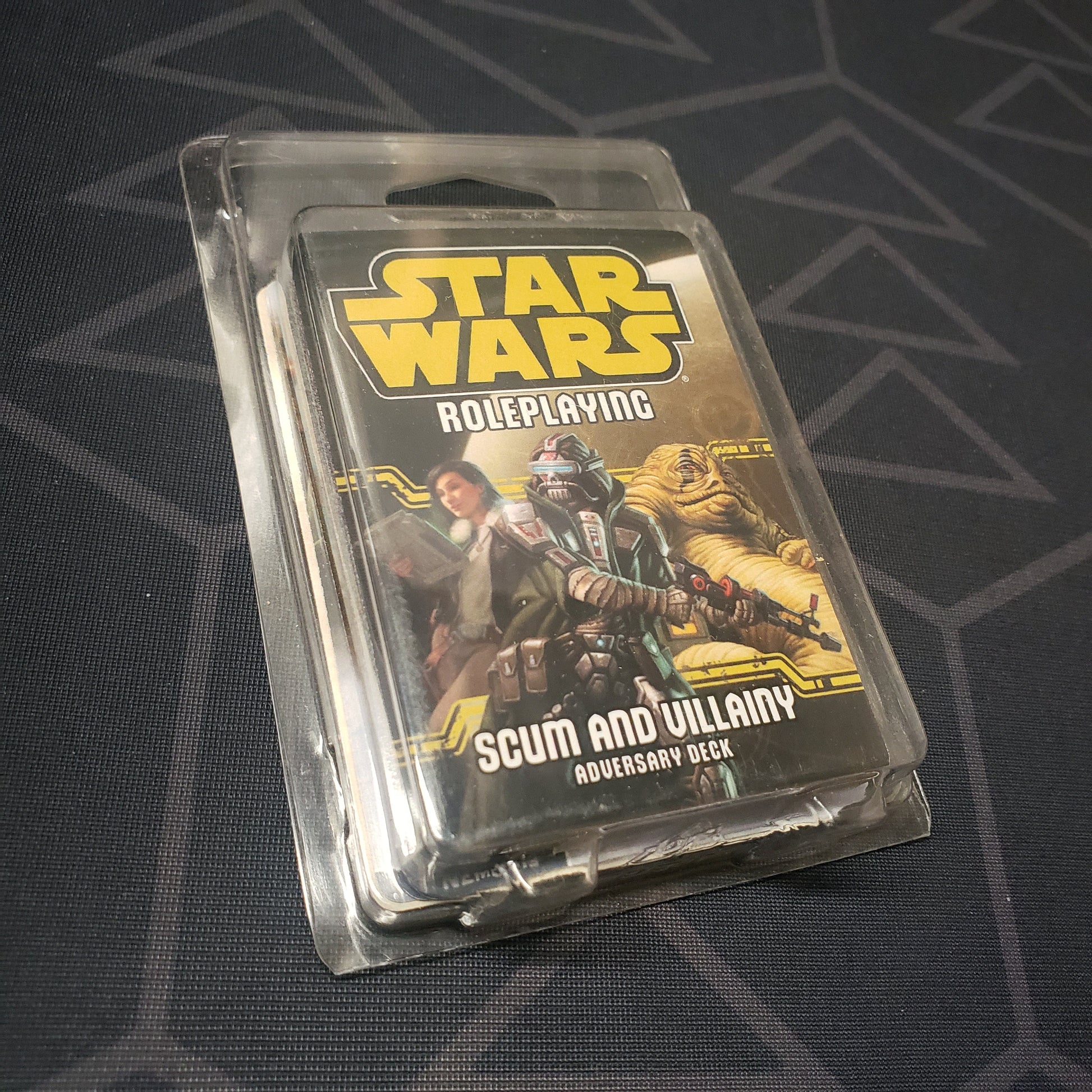 Image shows the front of the clamshell packaging for the Scum and Villainy Adversary Deck for the Star Wars Roleplaying game system