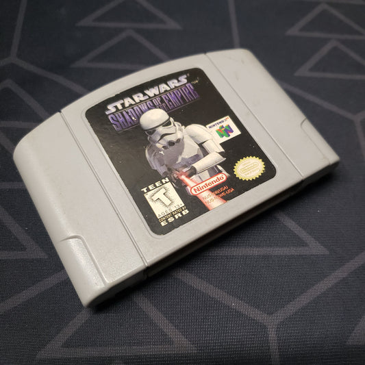 Image shows the front of the cartridge for the video game Star Wars: Shadows of the Empire for the Nintendo 64