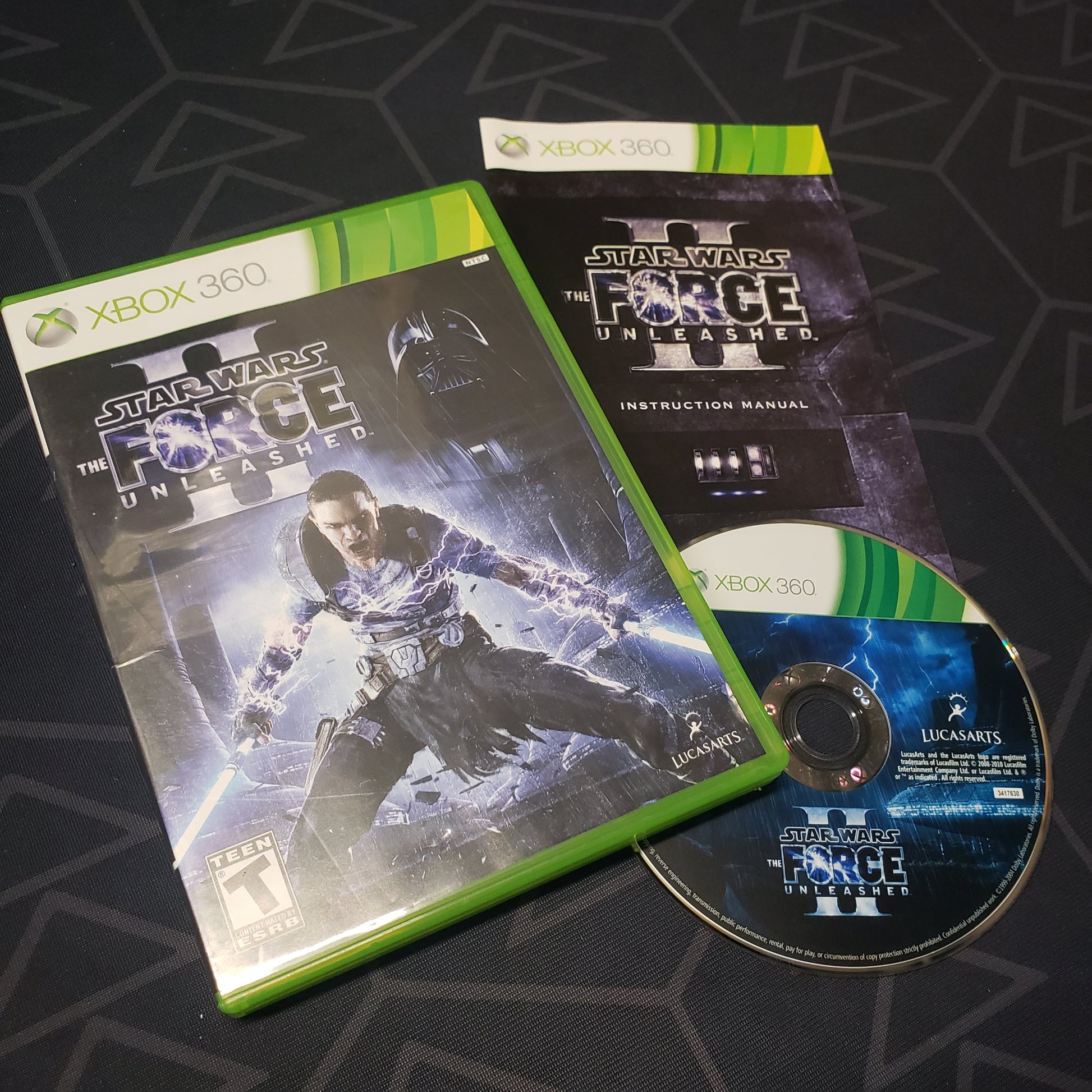 Image shows the case, manual and disc for the video game Star Wars: The Force Unleashed II for Xbox 360