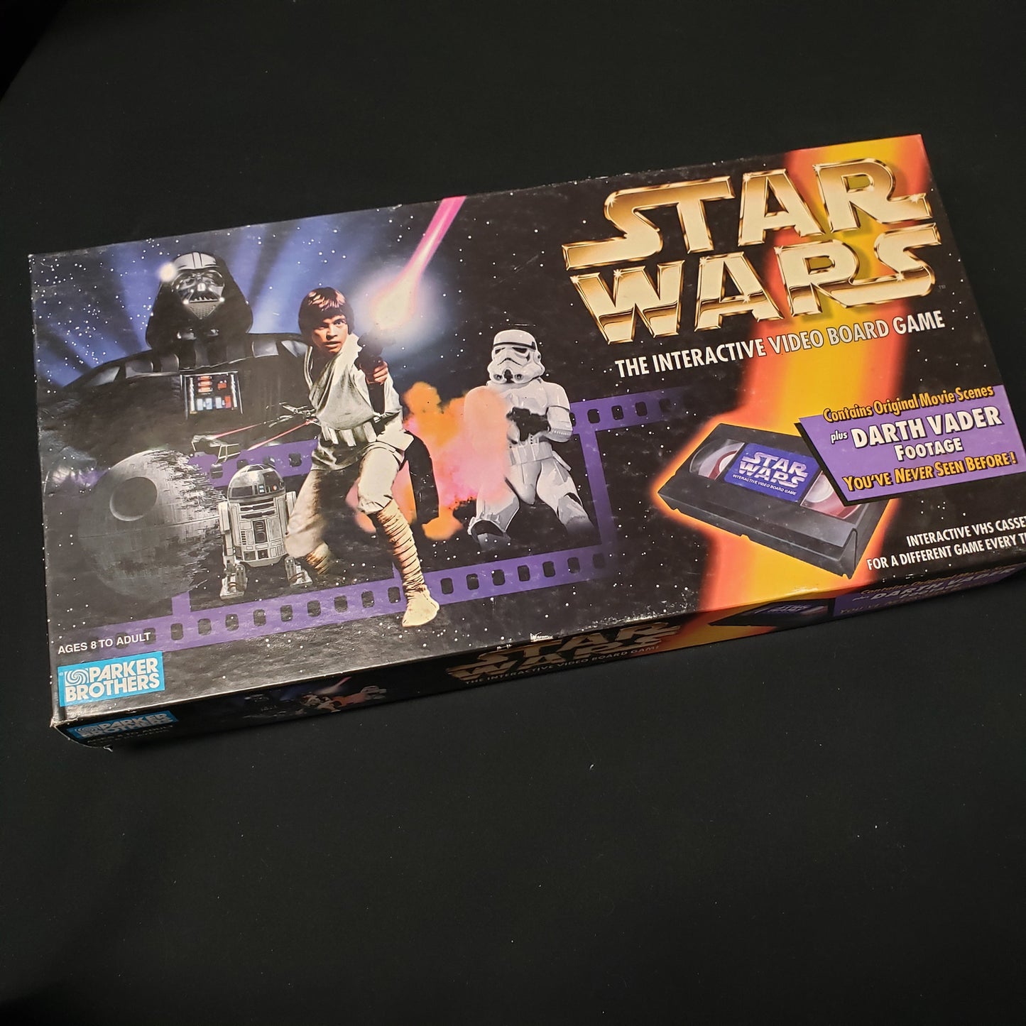 Image shows the front cover of the box for the Star Wars: The Interactive Video Board Game
