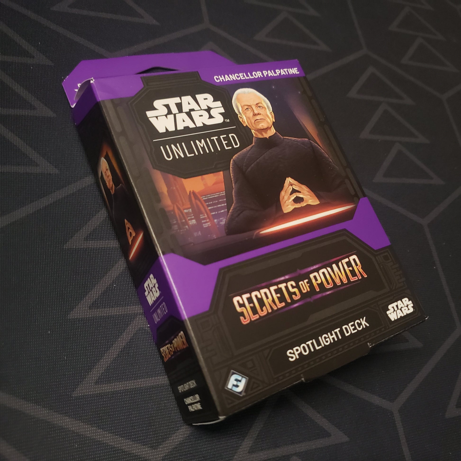 Image shows the front cover of the box of the Secrets of Power Spotlight Deck: Chancellor Palpatine for the card game Star Wars Unlimited