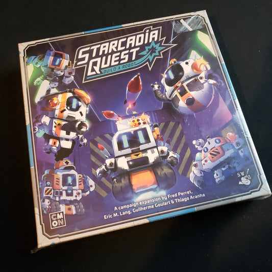 Image shows the front of the box for the Build-A-Robot Expansion for the Starcadia Quest board game