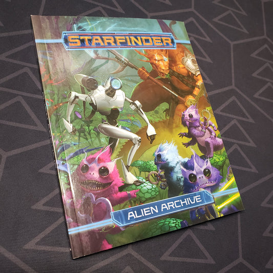 Image shows the front cover of the Alien Archive (Pocket Edition) book for the roleplaying game Starfinder 1E
