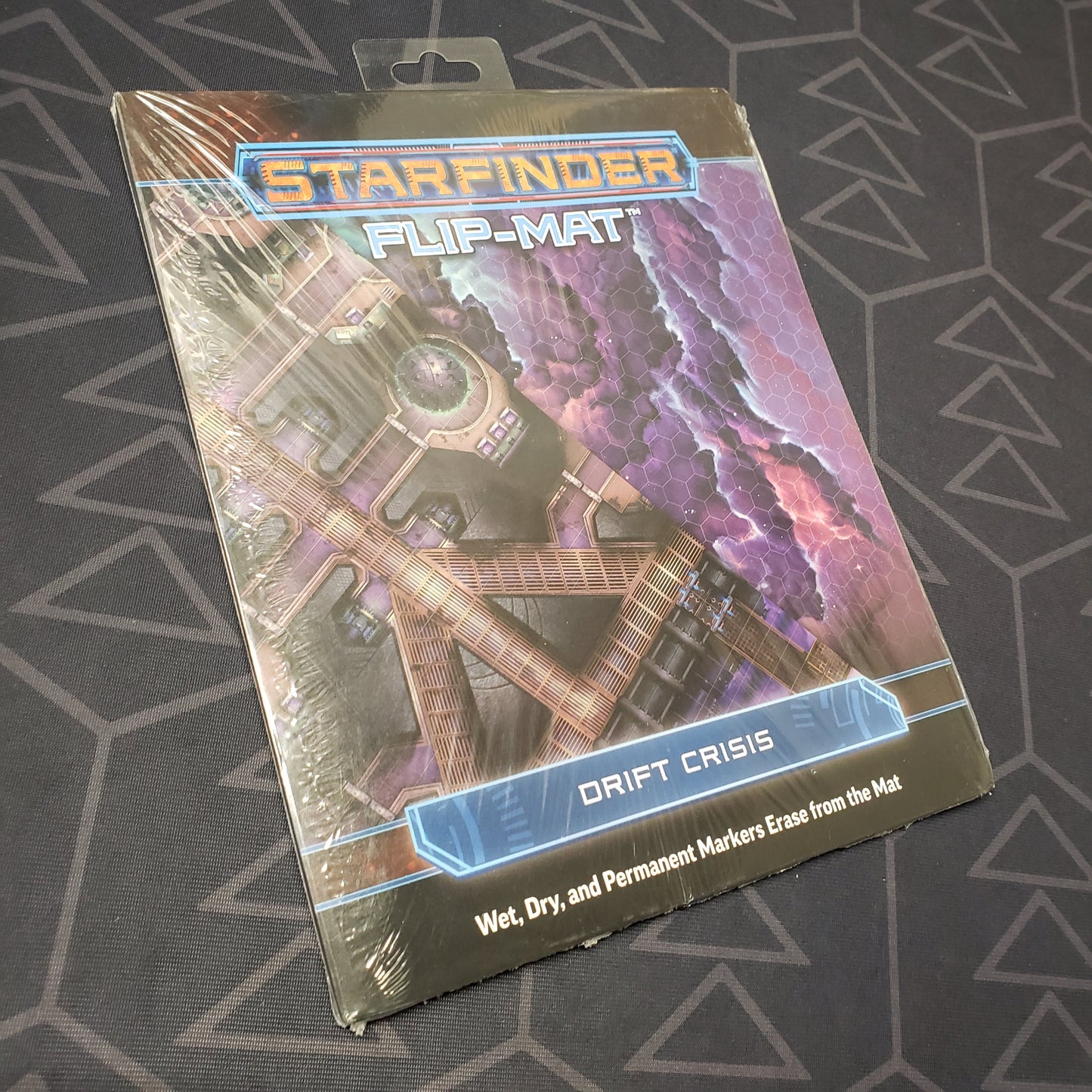 Image shows the front cover of the Flip-Mat: Drift Crisis pack for the roleplaying game Starfinder 1E