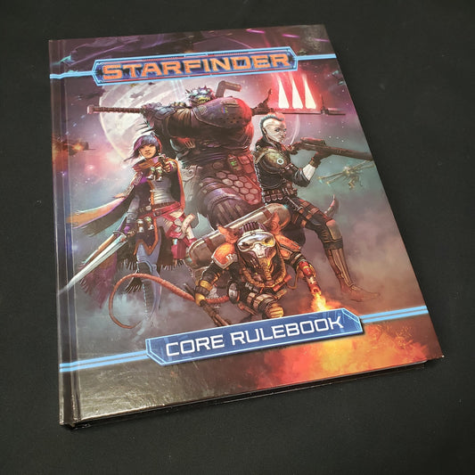 Image shows the front cover of the core rulebook for the roleplaying game Starfinder: First Edition