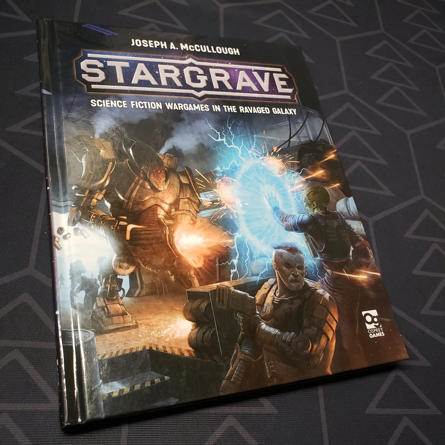 Image shows the front cover of the Stargrave: Science Fiction Wargames in the Ravaged Galaxy wargaming book