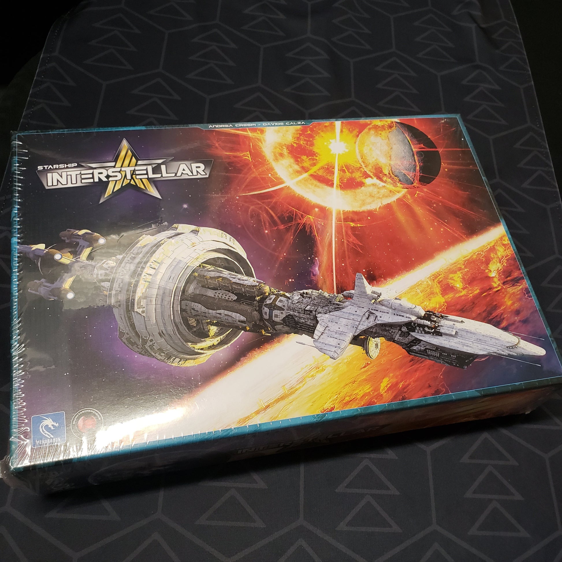 Image shows the front cover of the box for the Starship Interstellar board game