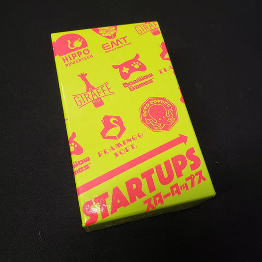 Image shows the front cover of the box of the Startups card game