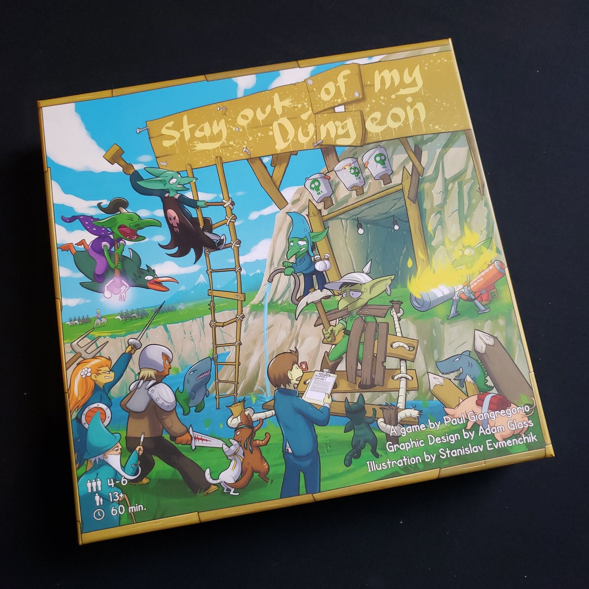 Image shows the front cover of the box of the Stay Out Of My Dungeon! board game