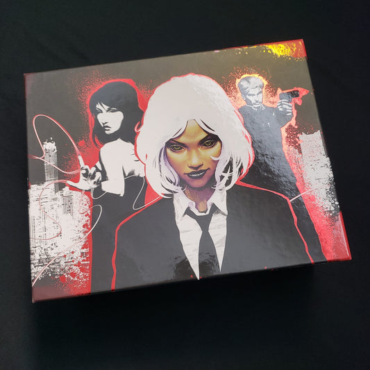 Image shows the front cover of the box of the deluxe edition of the Stealing Stories for the Devil roleplaying game