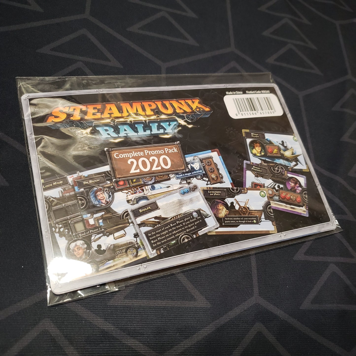 Image shows the front of the packaging of the Complete Promo Pack 2020 for the board game Steampunk Rally