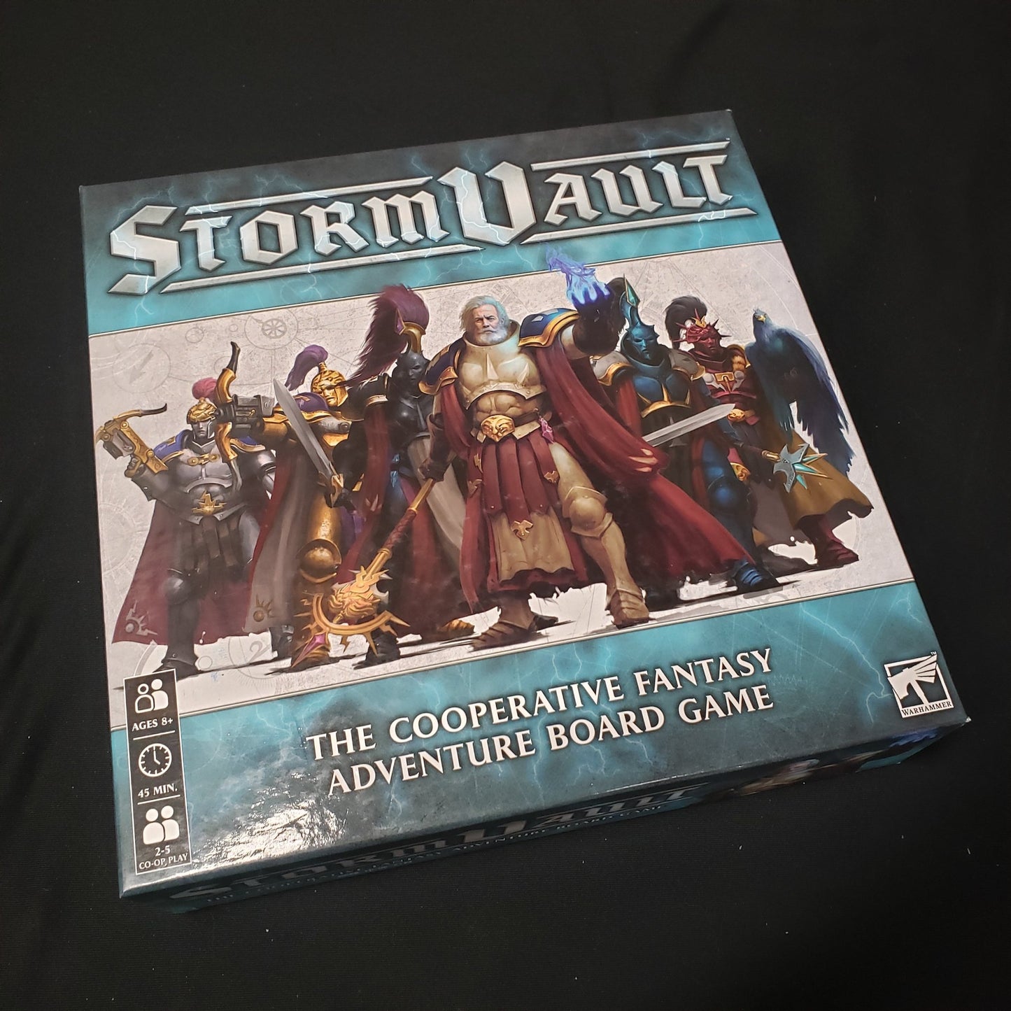 Image shows the front cover of the box of the Stormvault board game