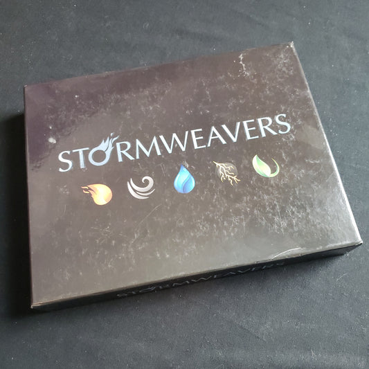 Image shows the front cover of the box of the Stormweavers card game